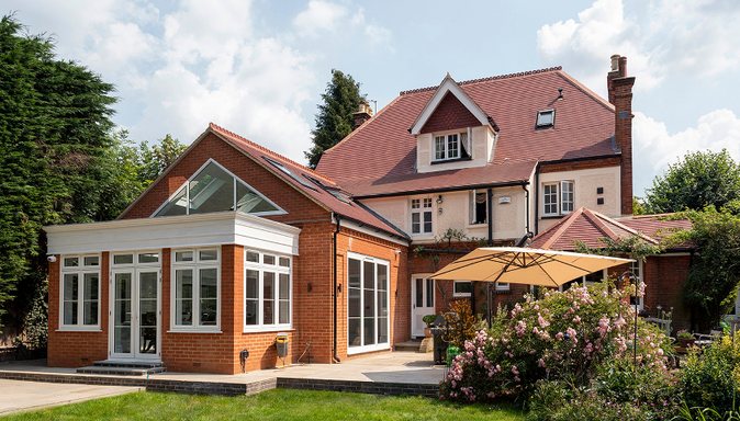 Extended and refurbished home with garden by Henley Build