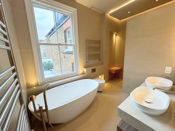Bathroom with freestanding bath and vessel basin