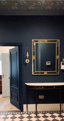 Deep navy hallway with gilt mirror and checkerboard marble floor, Belsize Park