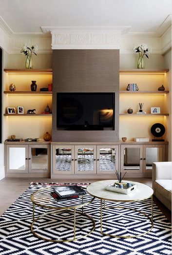 Reception room with backlit joinery and geometric rug, Kensington